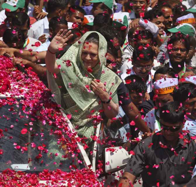 Sonia Gandhi waves to supporters as she arrives in Rae Bareli to file her nomination papers.