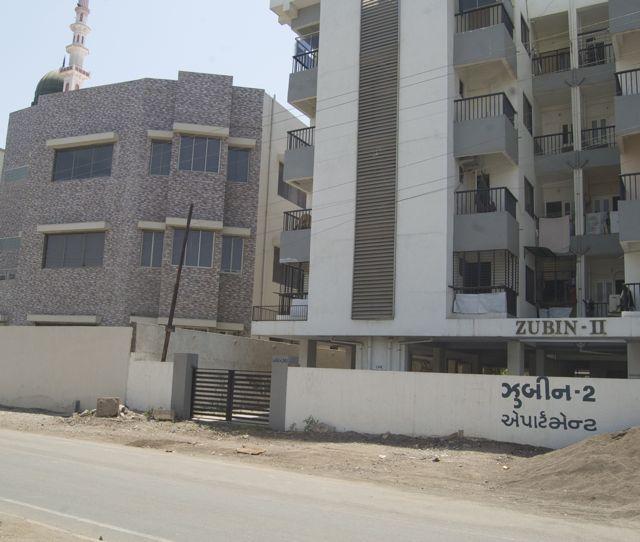 A mosque next to a building in Bhavnagar's Shishu Vihar extension. Hindus from adjacent Geeta Chowk claim the Muslims have exponentially increased their dwellings in the area in the last four years changing the demographics of the neighbourhood.