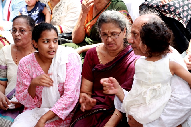 The bereaved family -- father R Vardarajan,mother Geetha, and wife Indhu Rebecca Varghese
