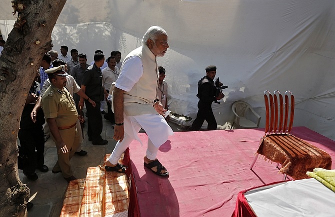 Modi arrives to address his supporters in Ahmedabad