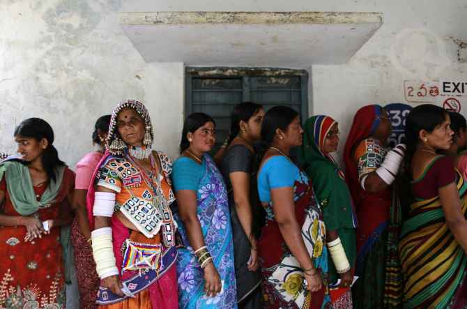 Voters line up to cast their votes outside a polling station in Rangareddy district in soon-to-be Telangana.