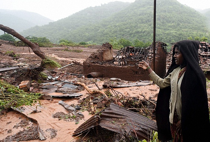 Relative of a landslide victim at Malin village in Pune