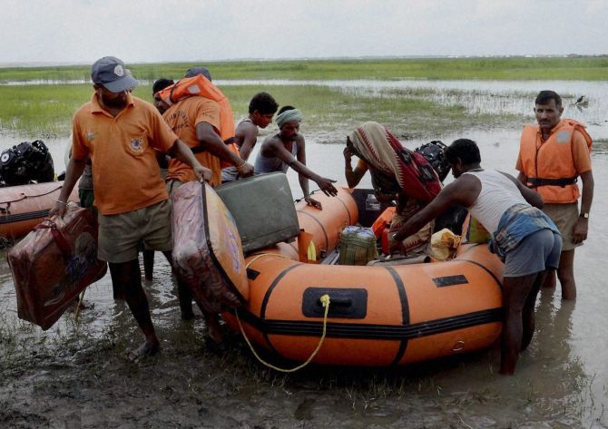 NDRF jawans rescue flood affected villagers near the Indo- Nepal border at Birpur.