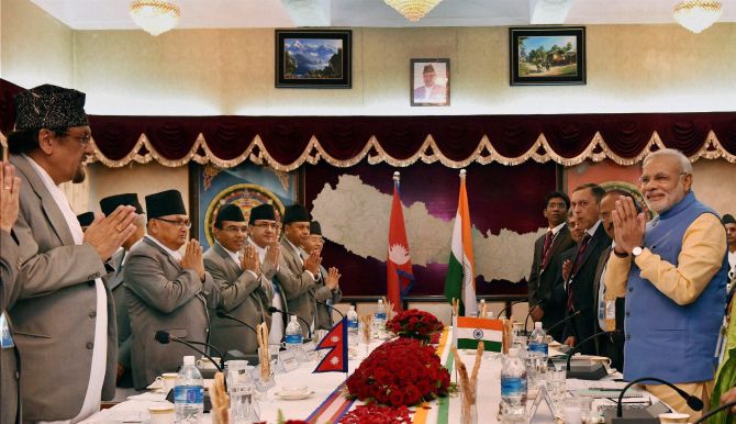 Prime Minister Narendra Modi and his Nepalese counterpart Prime Minister Sushil Koirala during a delegation level meeting at Chambers PMO, Singha Durbar in Kathmandu