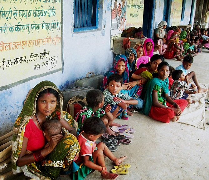 Villagers take shelter in a government school due to danger of Kosi embankments