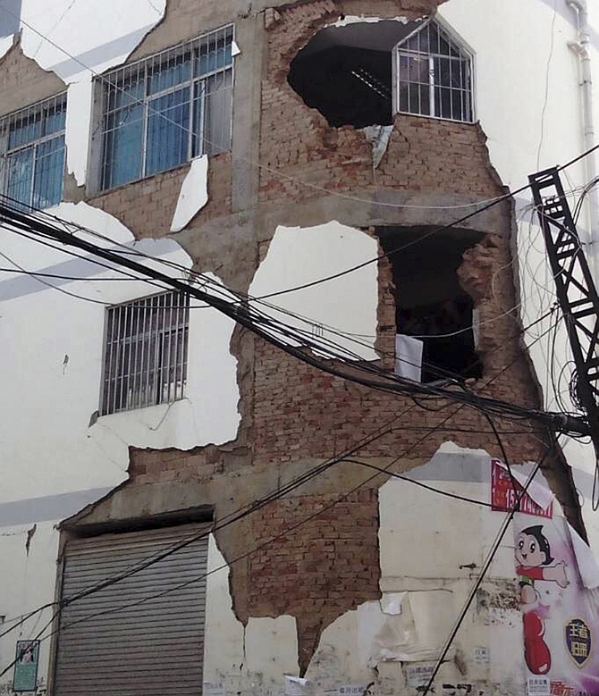 A building is damaged after an earthquake hit Ludian county, Yunnan province