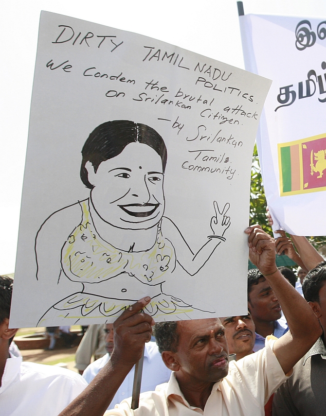 embers from the Sri Lankan Tamil community shout slogans against the state government