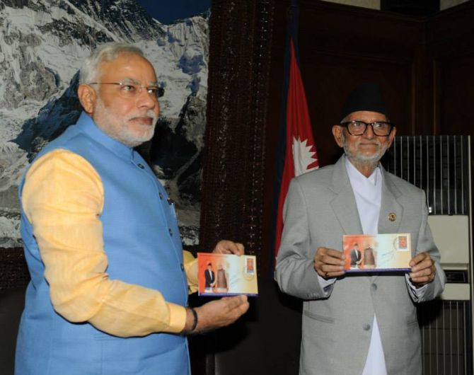 PM Modi and Nepal PM Sushil Koirala launch a new commemorative stamp