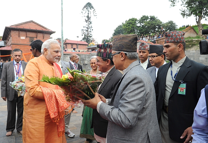 Modi is greeted as he arrives at the temple