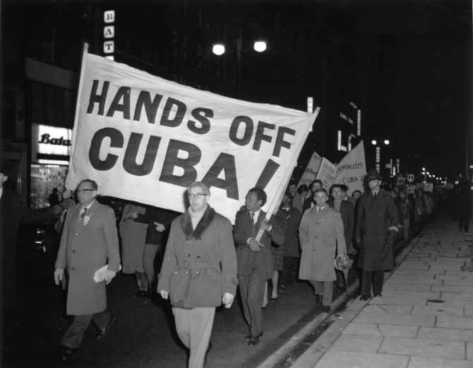 Peace activists protesting against US action in Cuba participate in a march in London in this 1962 photograph.