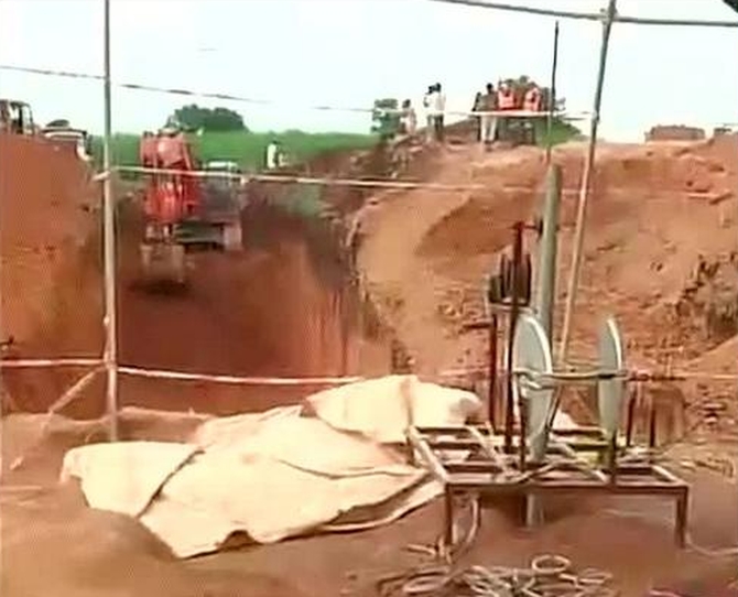 PICS: Rescuers race against time to save boy stuck in borewell