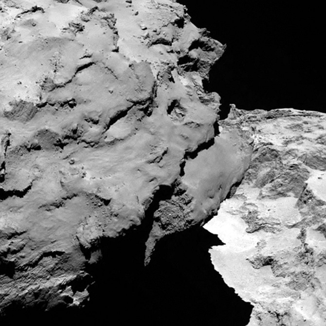 Close-up detail of comet 67P/Churyumov-Gerasimenko. The image was taken by Rosetta's OSIRIS narrow-angle camera and downloaded on August 6. The image shows the comet's 'head' at the left of the frame, which is casting shadow onto the 'neck' and 'body' to the right. The image was taken from a distance of 120 km and the image resolution is 2.2 metres per pixel.