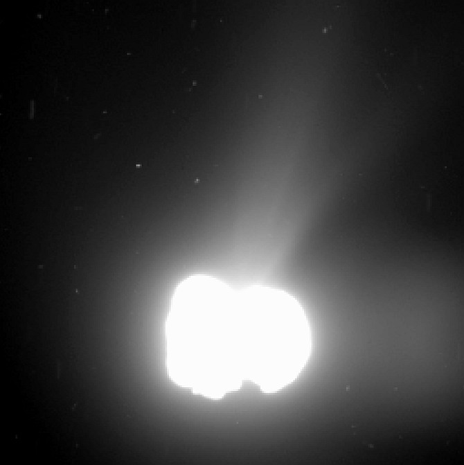 Comet 67P/Churyumov-Gerasimenko activity on 2 August 2014. The image was taken by Rosetta's OSIRIS wide-angle camera from a distance of 550 km. The exposure time of the image was 330 seconds and the comet nucleus is saturated to bring out the detail of the comet activity. Note there is a ghost image to the right. The image resolution is 55 metres per pixel.
