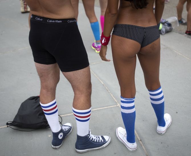 People pose for photos before the Underwear Run in Central Park in New York. 
