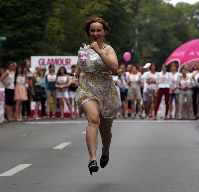 A participant runs in high-heels as she competes in the Stiletto Run in Bucharest.