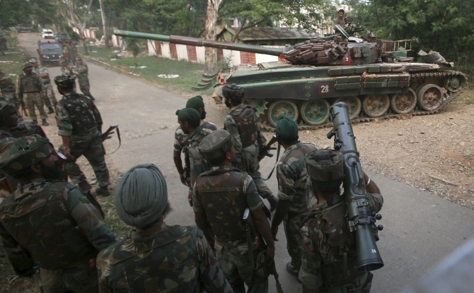 An Indian Army tank is deployed during an operation to flush out terrorists at an army camp in Mesar in Samba district.