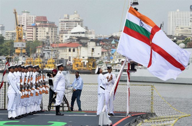 Naval officers leading the commissioning ceremony of INS Kolkata (D63) the lead ship of the Kolkata-class guided-missile destroyers at the Naval Dockyard