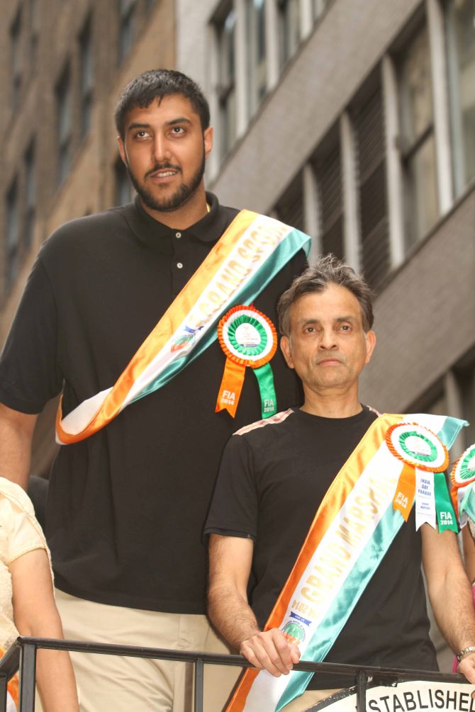 NBA basketball player Sim Bhullar and owner of the Sacramento Kings Vivek Ranadive take part in the India Day parade. 