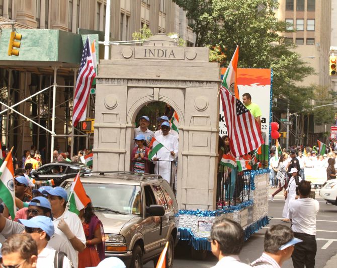 A flotilla with the replica of India Gate travels through down the streets of New York city.