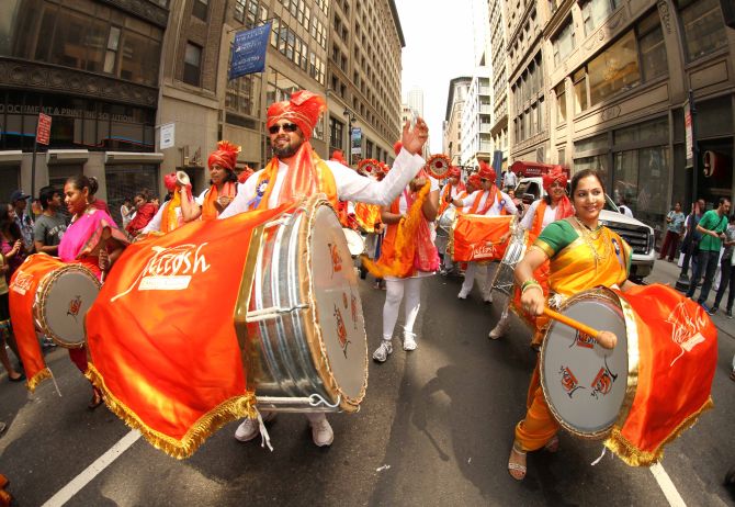 Performers play the dhols and drums during the parade, adding more vibrancy to the colourful parade. 