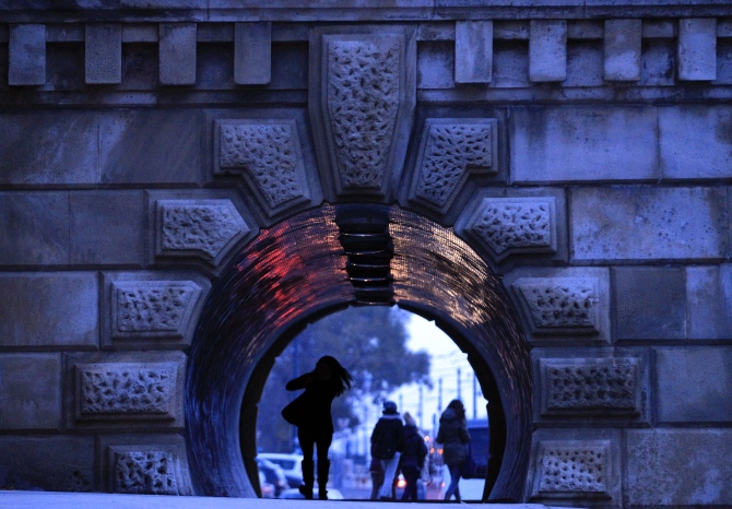 People walk through an underpass under the Chain Bridge in Budapest.