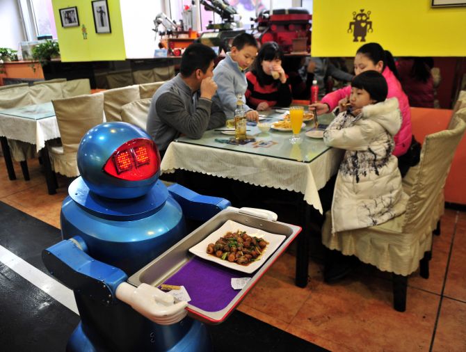 Into the future! Robots COOK up a storm in this restaurant