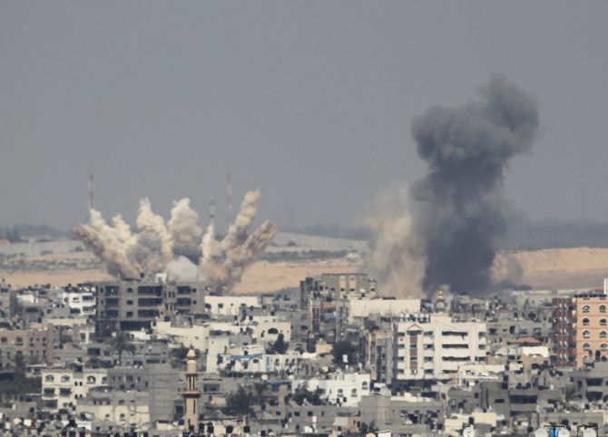 Smoke rises following what witnesses said were Israeli air strikes in Gaza. Israeli aircraft bombed the Gaza Strip on Saturday and Palestinian militants fired rockets at the Jewish state.