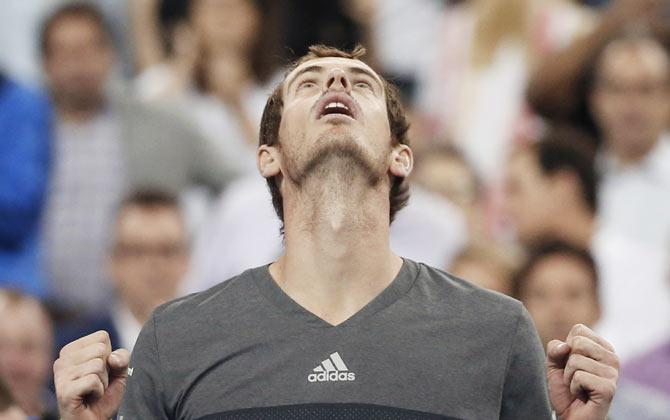 Andy Murray of Britain looks up and celebrates after defeating Matthias Bachinger of Germany in their US Open match on Thursday