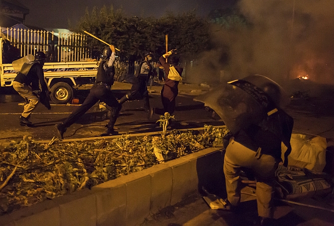 Riot police drive away demonstrators outside Pakistan's parliament in Islamabad, August 30, 2014. Photograph: Zohra Bensemra/Reuters