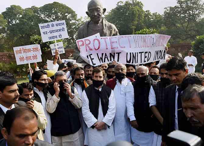 At Parliament, Rahul Leads Protest, BJP Sings Bhajans - Rediff.com ...