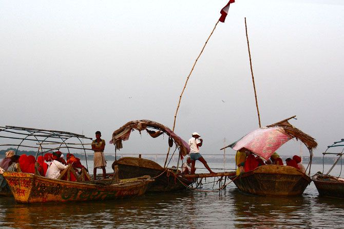 Boats connected by a platform at the Sangam Triveni