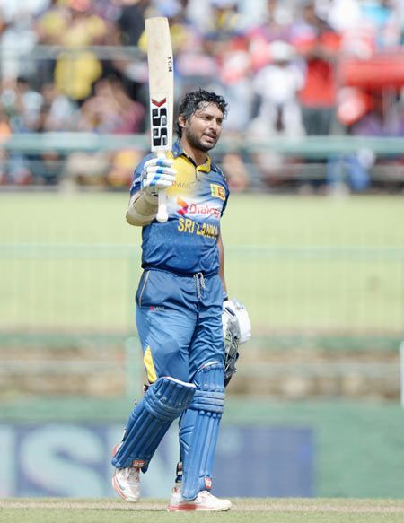 Kumar Sangakkara of Sri Lanka celebrates his century during the 6th One-Day International against England at Pallekele Cricket Stadium in Kandy on Saturday
