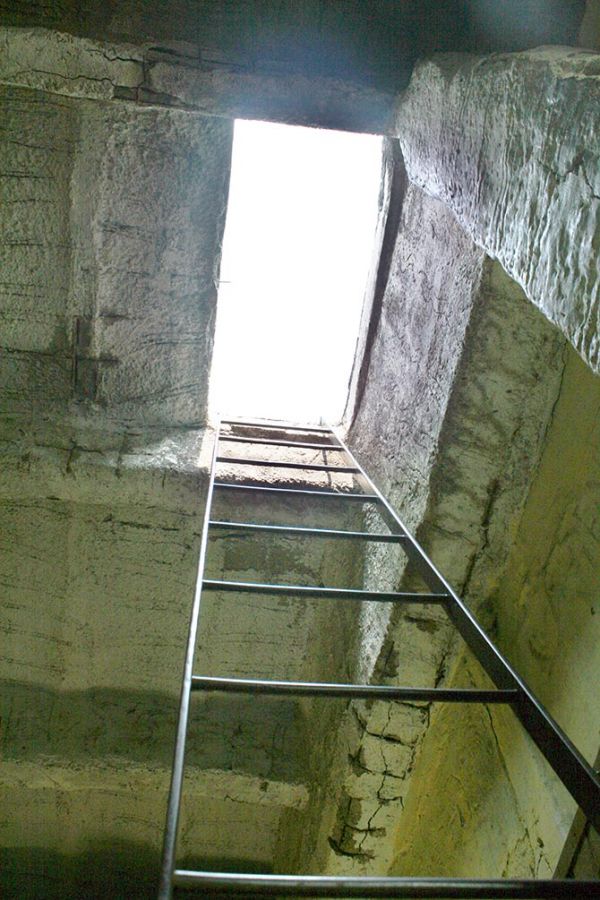 An iron staircase going to the roof