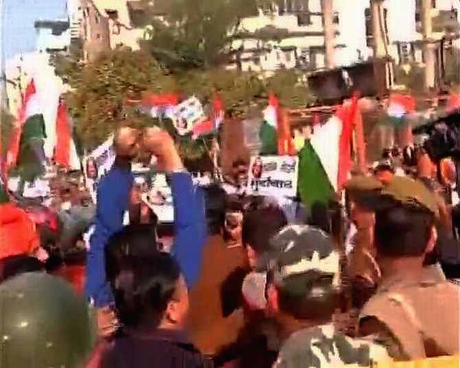 AAP supporters shout slogans in Kailash Colony