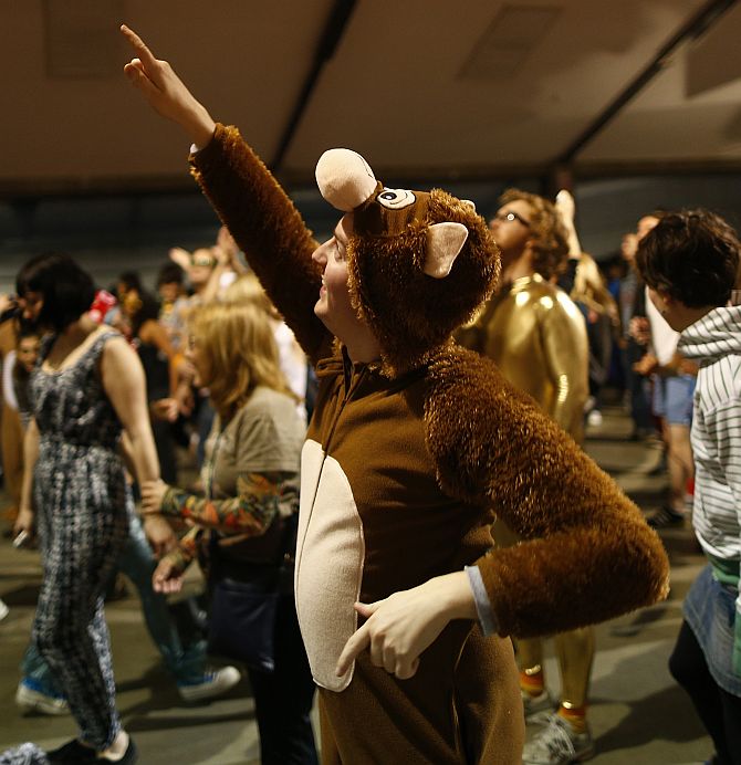 A reveller dances in his onesie at Morning Glory, in a venue in Hackney, London