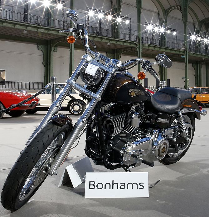 The 1,585 cc Harley Davidson Dyna Super Glide, donated to Pope Francis last year and signed by him on its tank, is displayed as part of Bonham's Les Grandes Marques du Monde vintage and classic cars sale at the Grand Palais in Paris