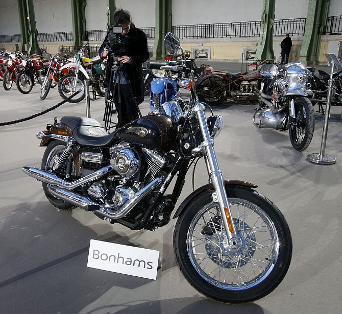 The 1,585 cc Harley Davidson Dyna Super Glide, donated to Pope Francis last year and signed by him on its tank, is displayed as part of Bonham's Les Grandes Marques du Monde vintage and classic cars sale at the Grand Palais in Paris