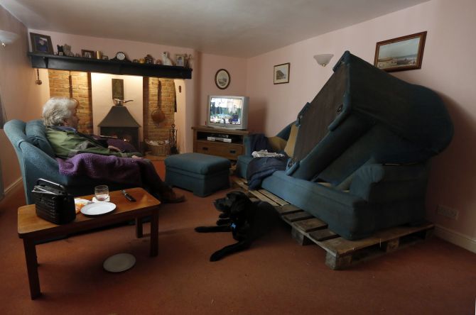 PHOTOS: Hundreds of homes inundated as UK floods spread