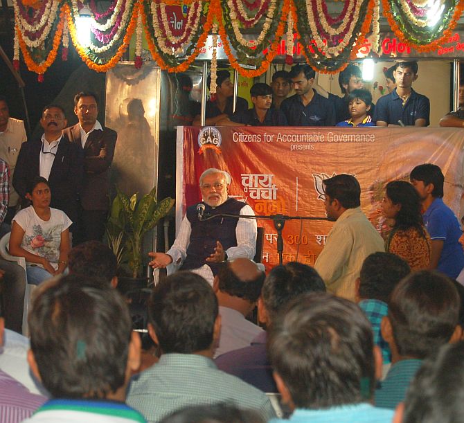 Narendra Modi interacts with people as he launched his 'Chai Pe Charcha' campaign on Wednesday.