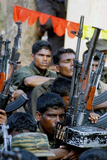 Tamil rebels keep watch during funeral procession of a slain commander at a Tamil rebel-controlled area in Batticaloa, eastern Sri Lanka in this photograph taken on May 24, 2006.