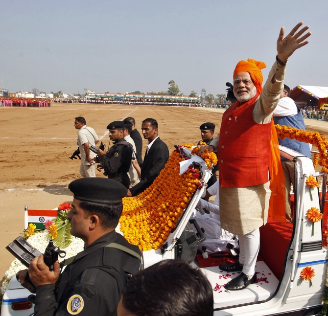 Narendra Modi waves to supporters in Gujarat.