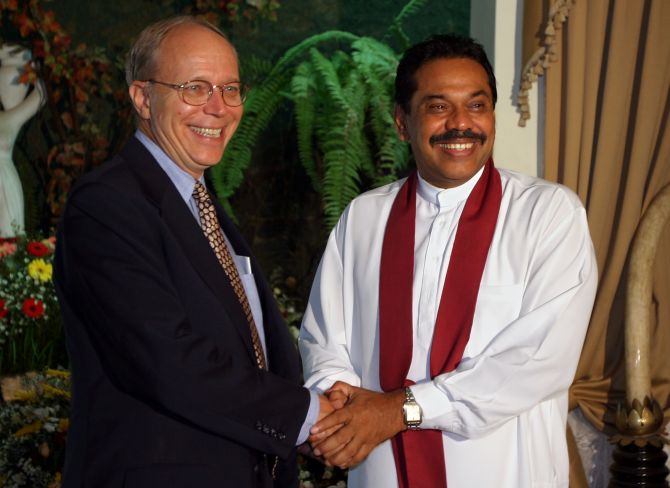 Then US ambassador Jeffrey Lunstead greets then Sri Lankan prime minister (now President) Mahinda Rajapakse in Colombo on April 8, 2004.