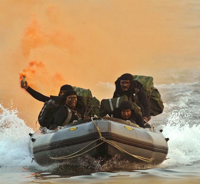 The Indian Navy's marine commandos show their skills in Visakhapatnam. Photographs: Kamal Kishore/Reuters