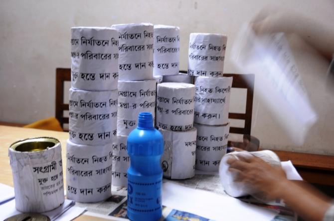 Donation boxes being prepared to collect funds for the family