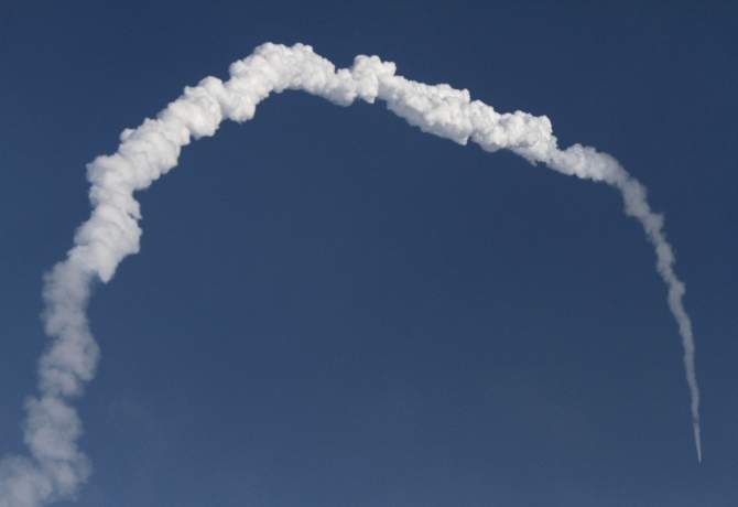 A contrail is seen as India's GSLV-D5 blasts off from the Satish Dhawan space centre at Sriharikota