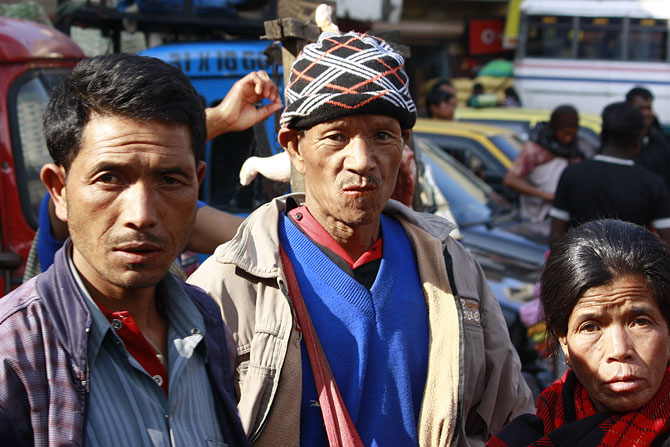 Locals waiting to cross the road at Shillong's Bara Bazar.