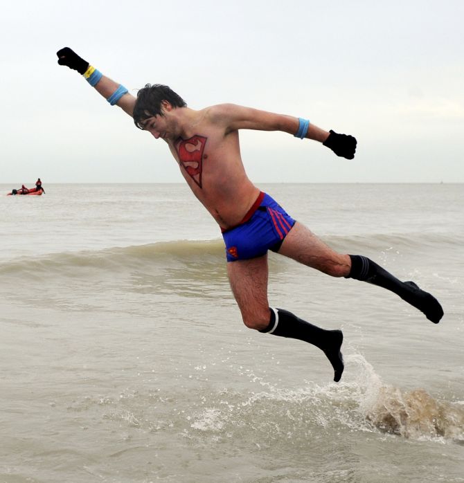 ODD WORLD: Superman takes first bath of 2014 in the North Sea