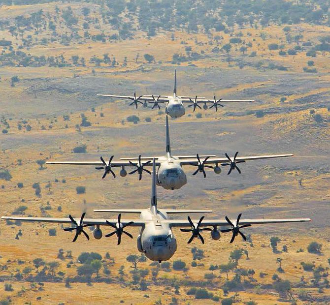 A Hercules C-130J aircraft practices low-level tactical formation over the deserts of Rajasthan.