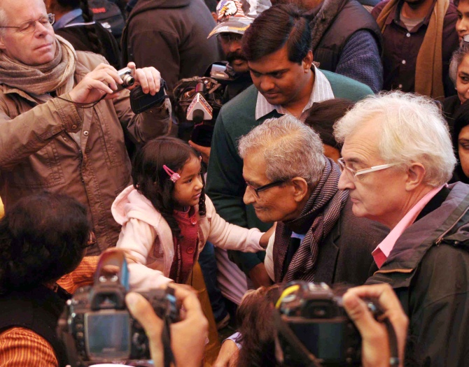 Nobel Laureate Amartya Sen is greeted by a child at the Jaipur Literature Festival