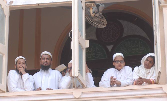 Members of the Bohra Muslim community morn the demise of their spiritual leader Syedna Burhanuddin, in Mumbai on Saturday